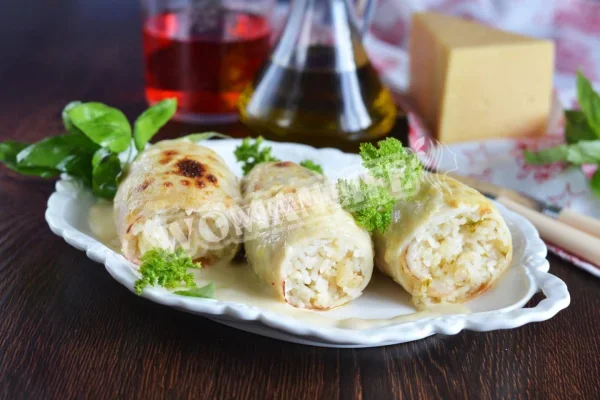 Кальмари, фаршировані креветками, сиром і рисом
