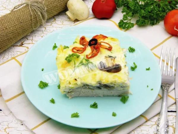 Куряче м'ясо по-французьки з курки з грибами в духовці