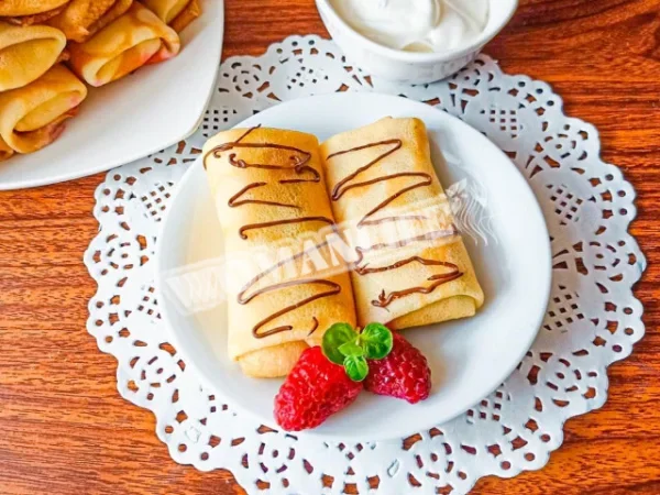 Млинці з сиром і родзинками